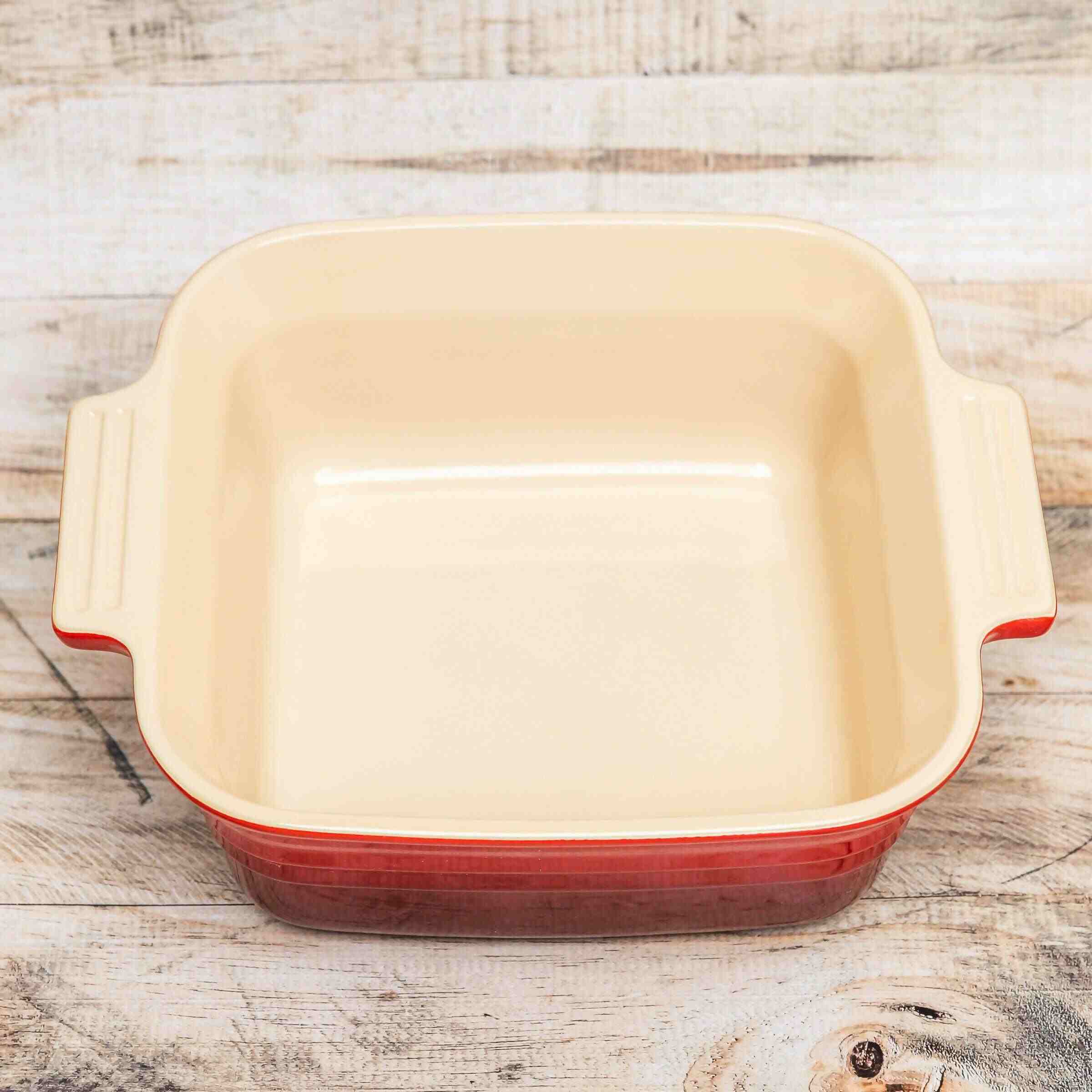 Pre-owned, gently used cerise Le Creuset Stoneware 3 Quart Square Casserole Dish With Lid, inside of dish